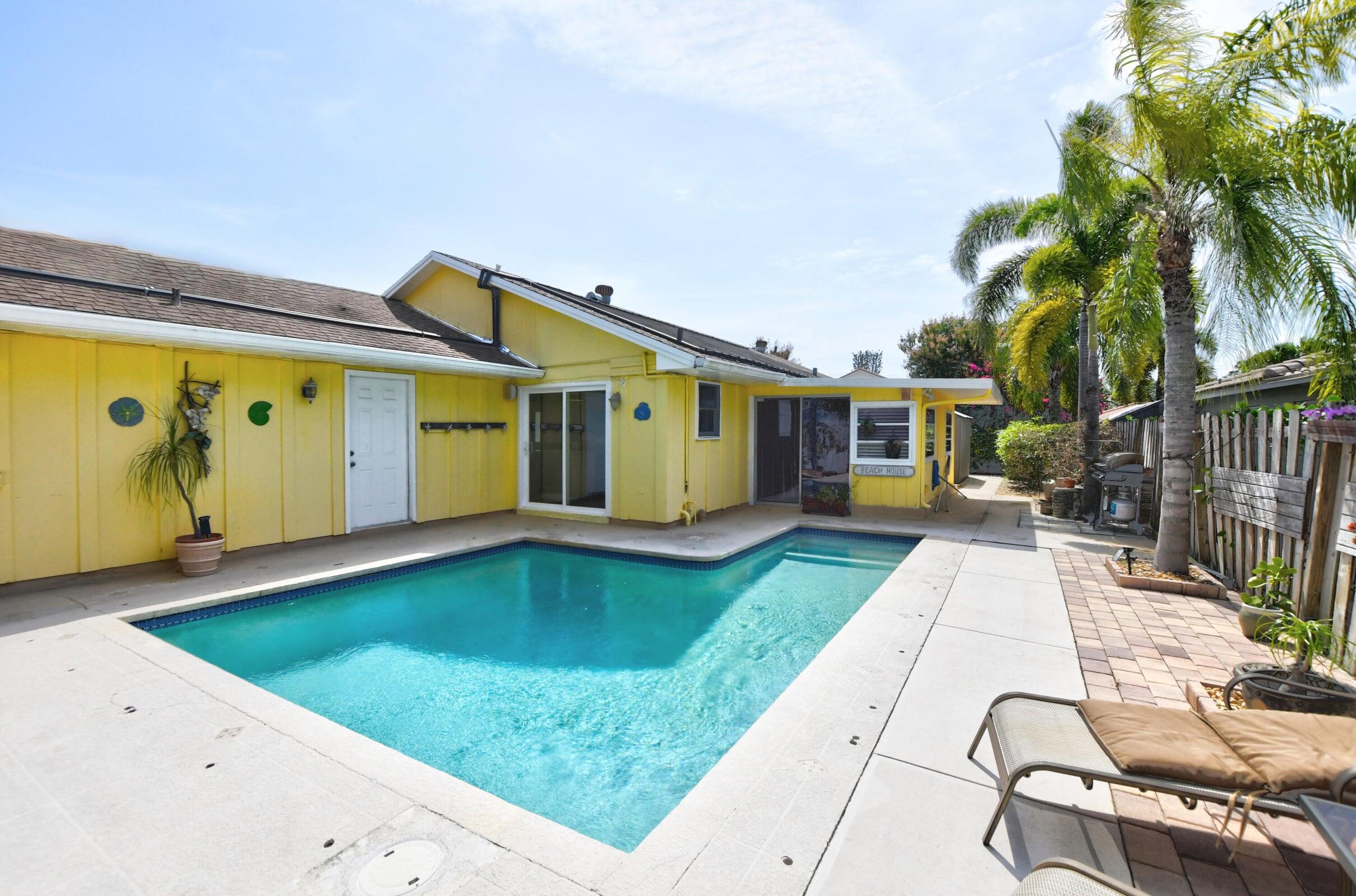 1599 Isabel Este Road Boca Raton, FL 33486 - Photo 17 of 22 a view of swimming pool with a patio