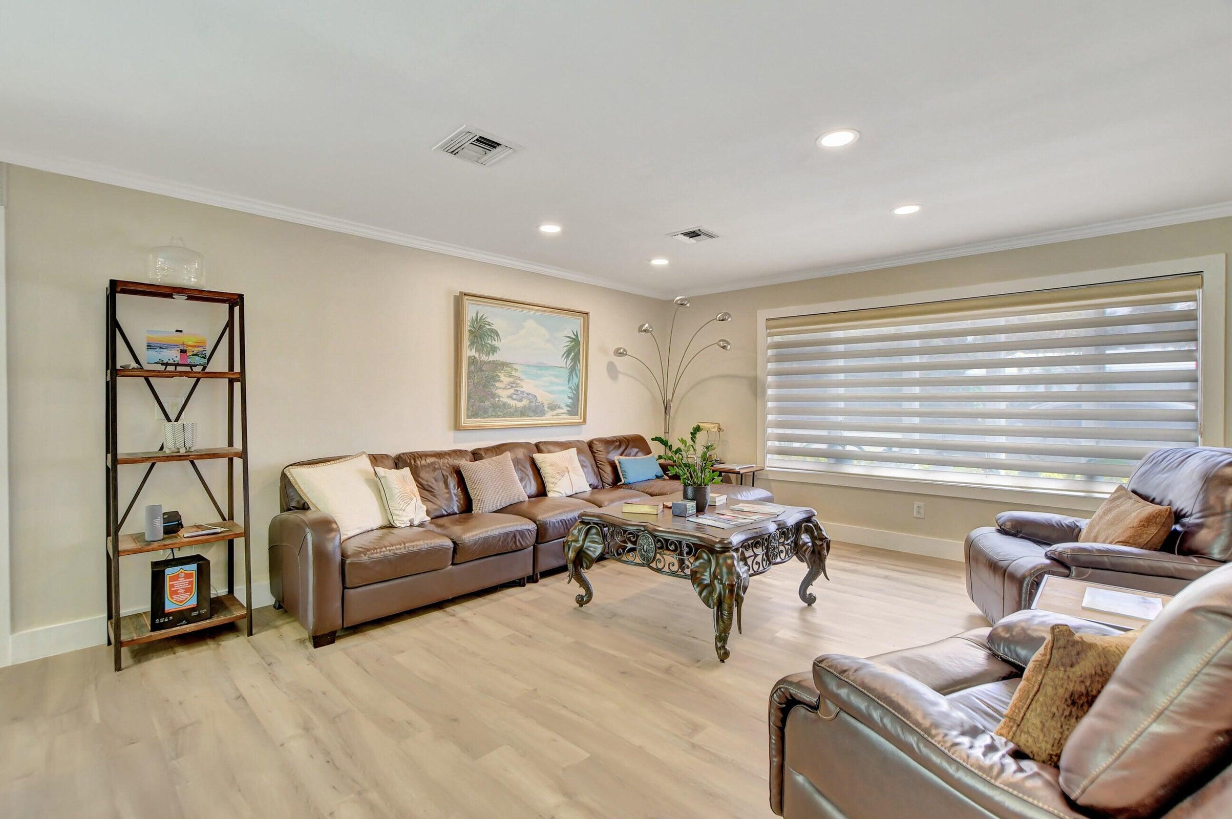 1599 Isabel Este Road Boca Raton, FL 33486 - Photo 8 of 22 a living room with furniture and a large window