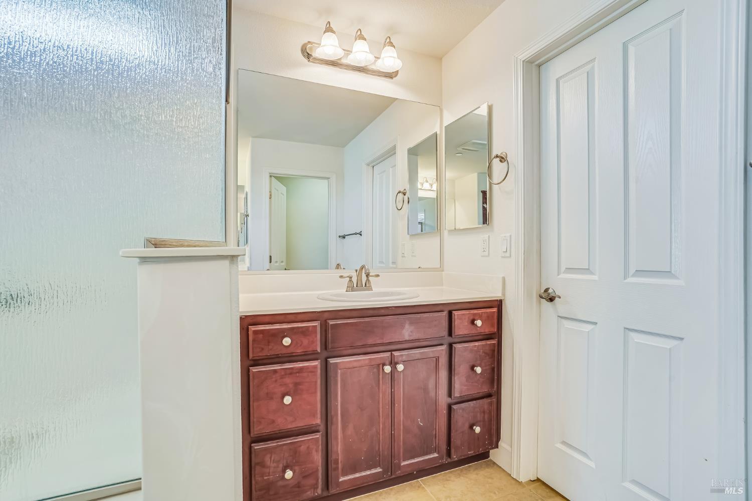305 Birch Ridge Drive Rio Vista, CA 94571 - Photo 29 of 30 a spacious bathroom with a granite countertop sink a mirror and a