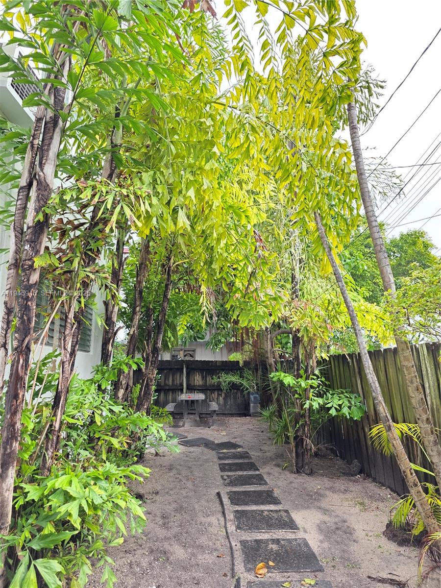 824 82nd Street, Unit 4 Miami Beach, FL 33141 - Photo 5 of 13 a backyard of a house with lots of green space