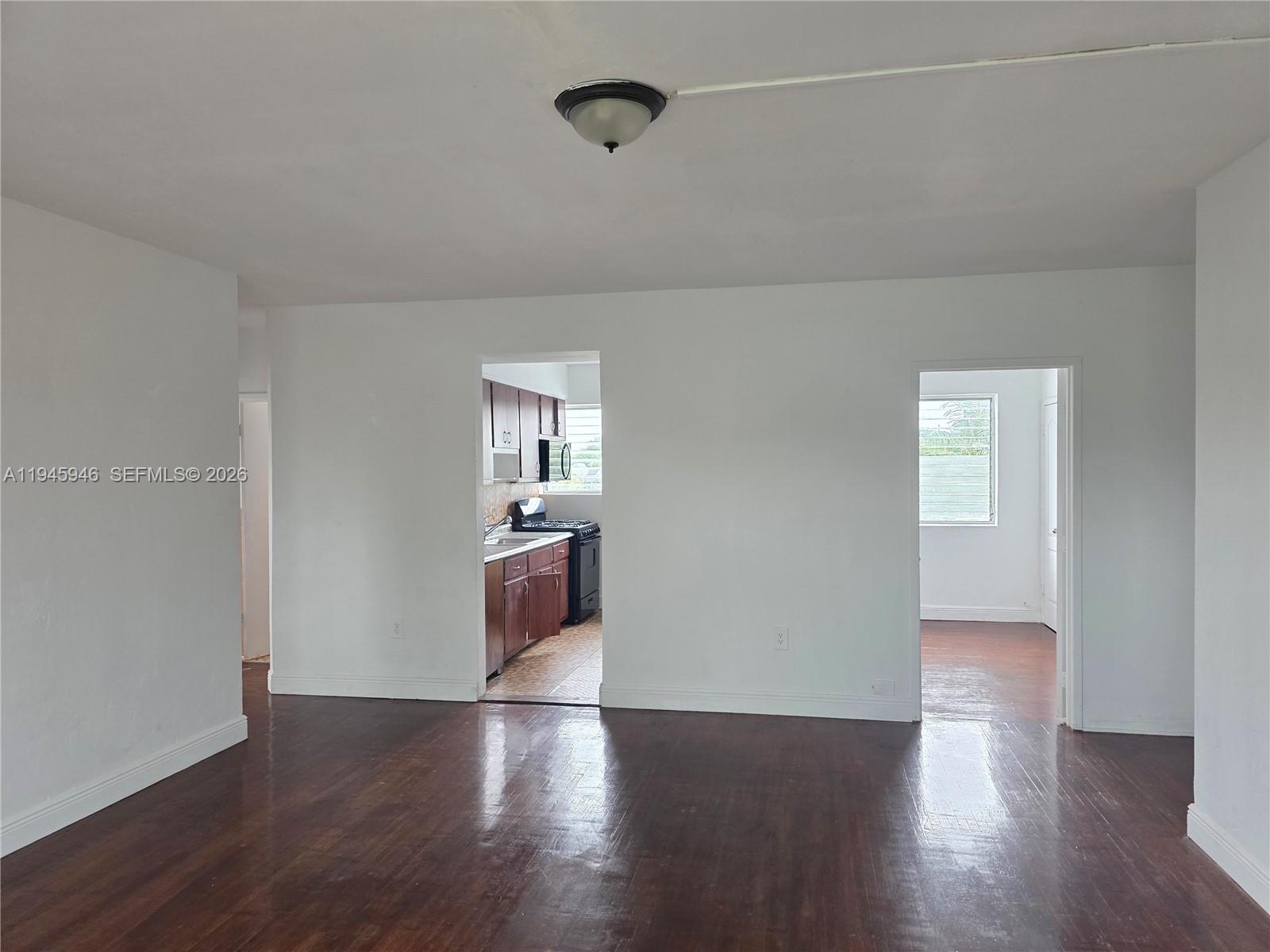 824 82nd Street, Unit 4 Miami Beach, FL 33141 - Photo 9 of 13 a view of a livingroom with wooden floor