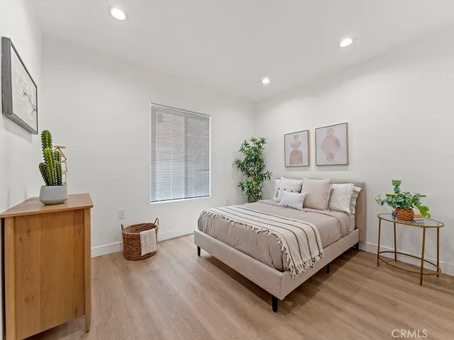 a bedroom with a bed and table