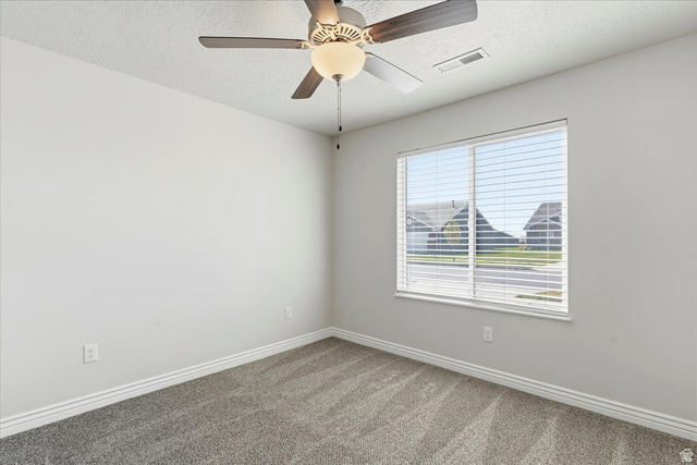 2028 West Grace Way Layton, UT 84041 - Photo 22 of 36 Unfurnished room with ceiling fan, a textured ceiling, and carpet floors