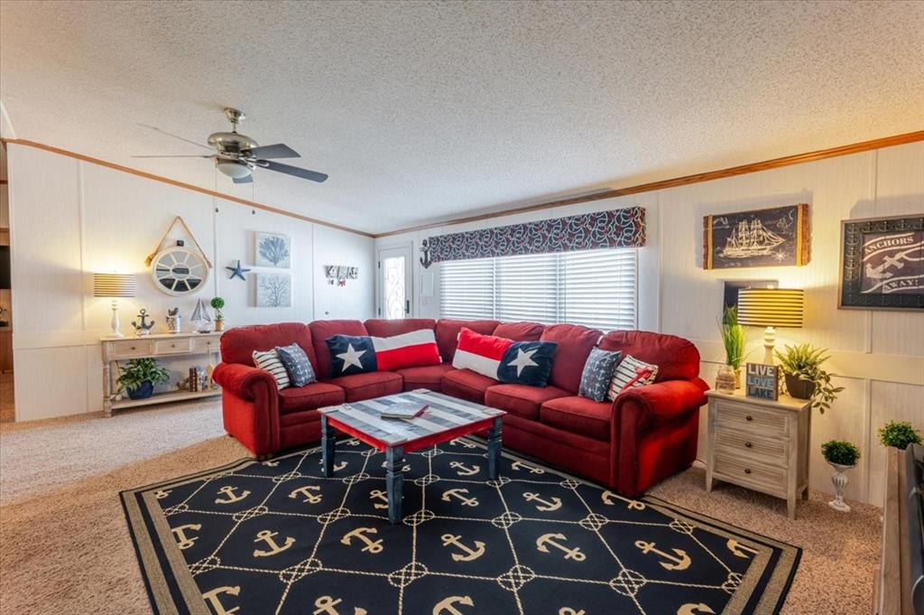 4441 Chapel Road Graham, TX 76450 - Photo 16 of 39 a living room with furniture a couch and dresser