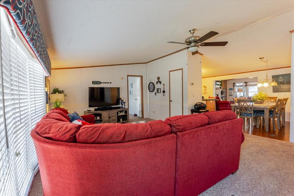 4441 Chapel Road Graham, TX 76450 - Photo 22 of 39 a living room with furniture and a flat screen tv