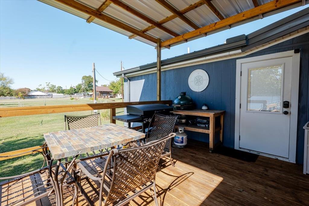 4441 Chapel Road Graham, TX 76450 - Photo 30 of 39 a view of a patio with table and chairs