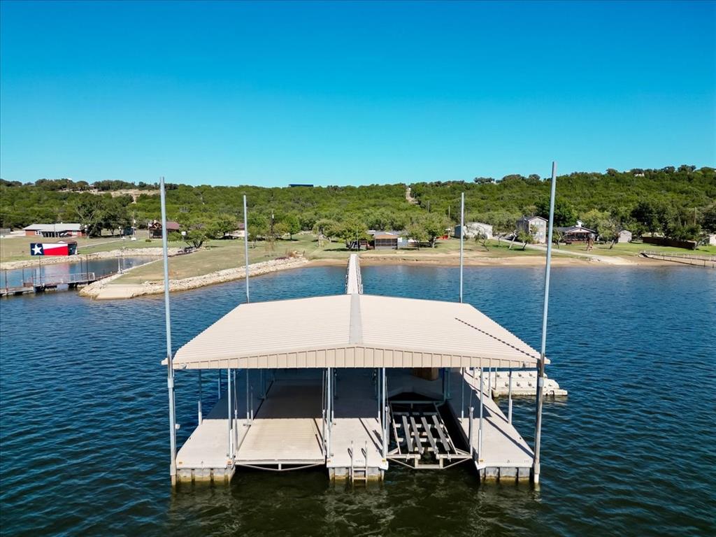 4441 Chapel Road Graham, TX 76450 - Photo 9 of 39 a view of a swimming pool and lounge chairs