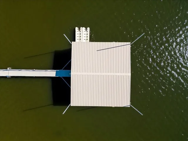 an aerial view of a house with mountain view