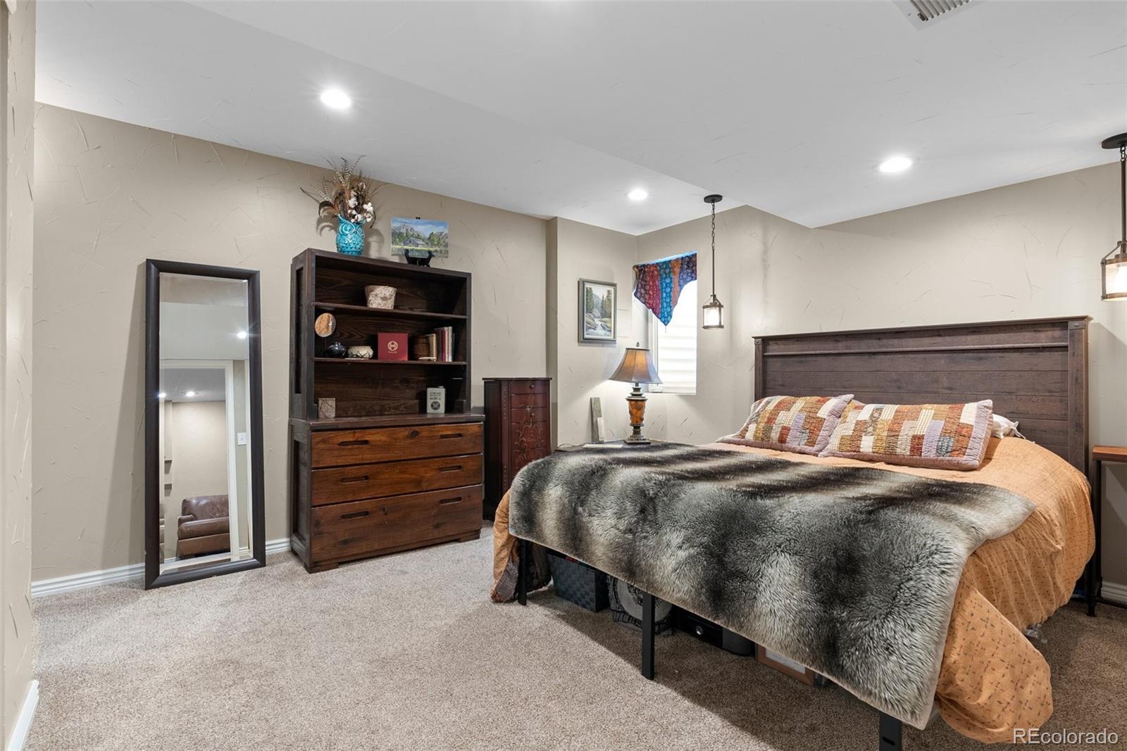 87 Prairie Ridge Road Highlands Ranch, CO 80126 - Photo 28 of 40 a bedroom with a bed and closet