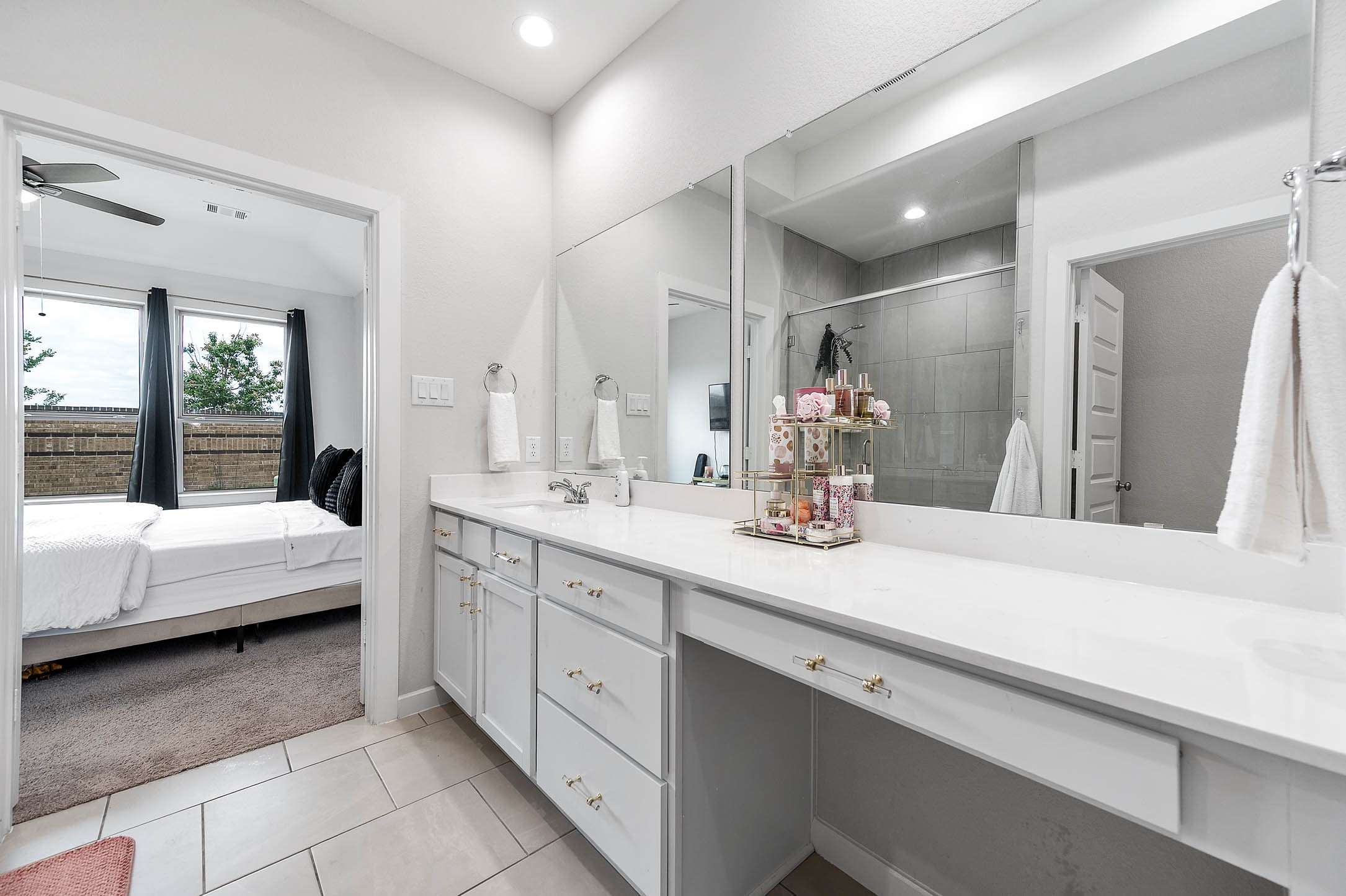 10926 Wander Way Beasley, TX 77417 - Photo 14 of 38 a en suite bathroom with a double vanity sink and mirror