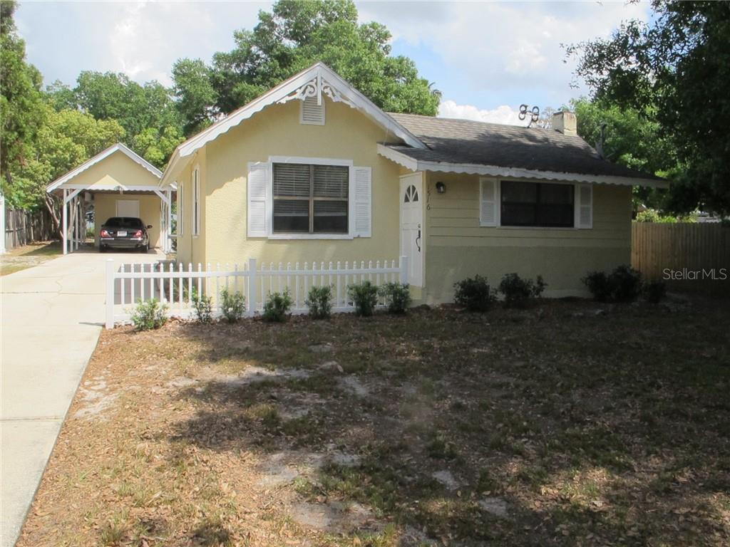 1516 Alexander Street Mount Dora, FL 32757 - Photo 1 of 1 a front view of a house with a yard
