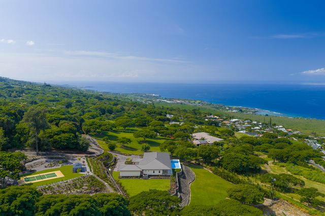 an aerial view of residential house with outdoor space