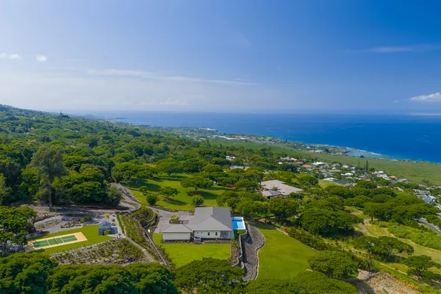 an aerial view of residential house with outdoor space