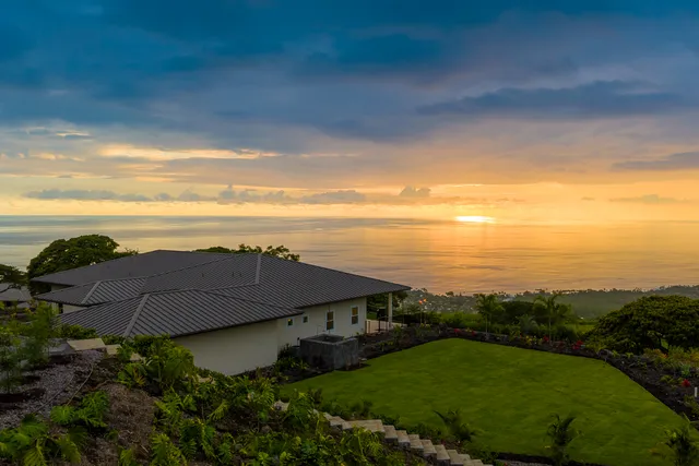 a view of a yard with an ocean