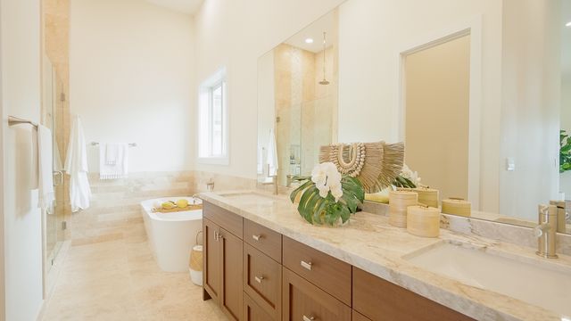 a spacious bathroom with a granite countertop sink and a mirror