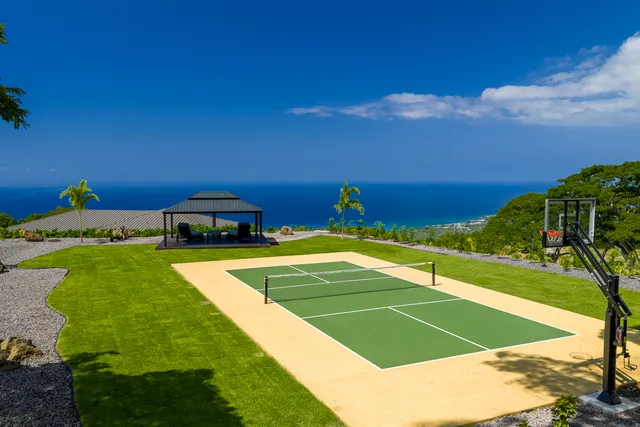 a view of an outdoor space and basketball court