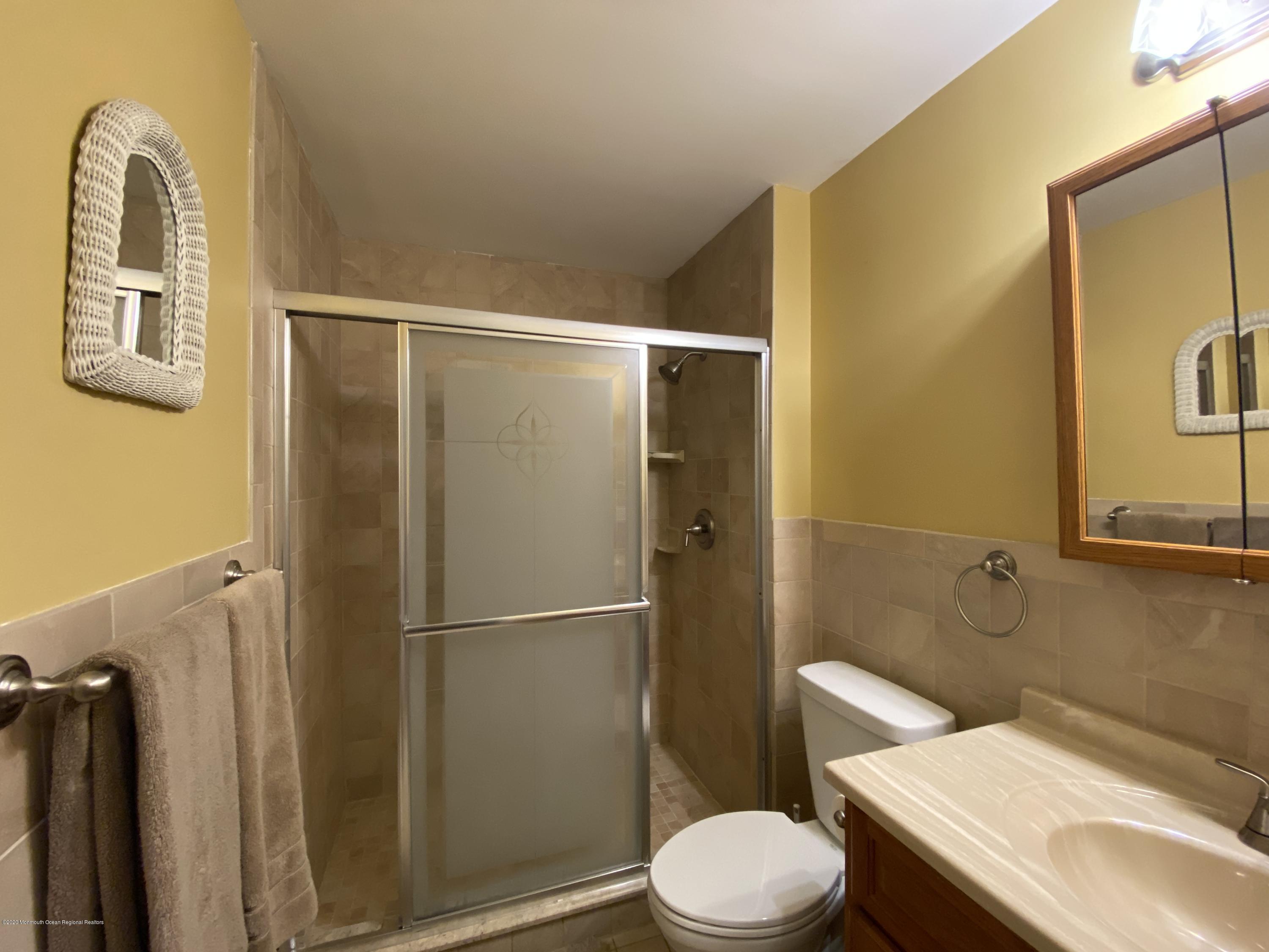 24 Cross Trees Road Brick, NJ 08723 - Photo 9 of 13 a bathroom with a sink toilet and shower
