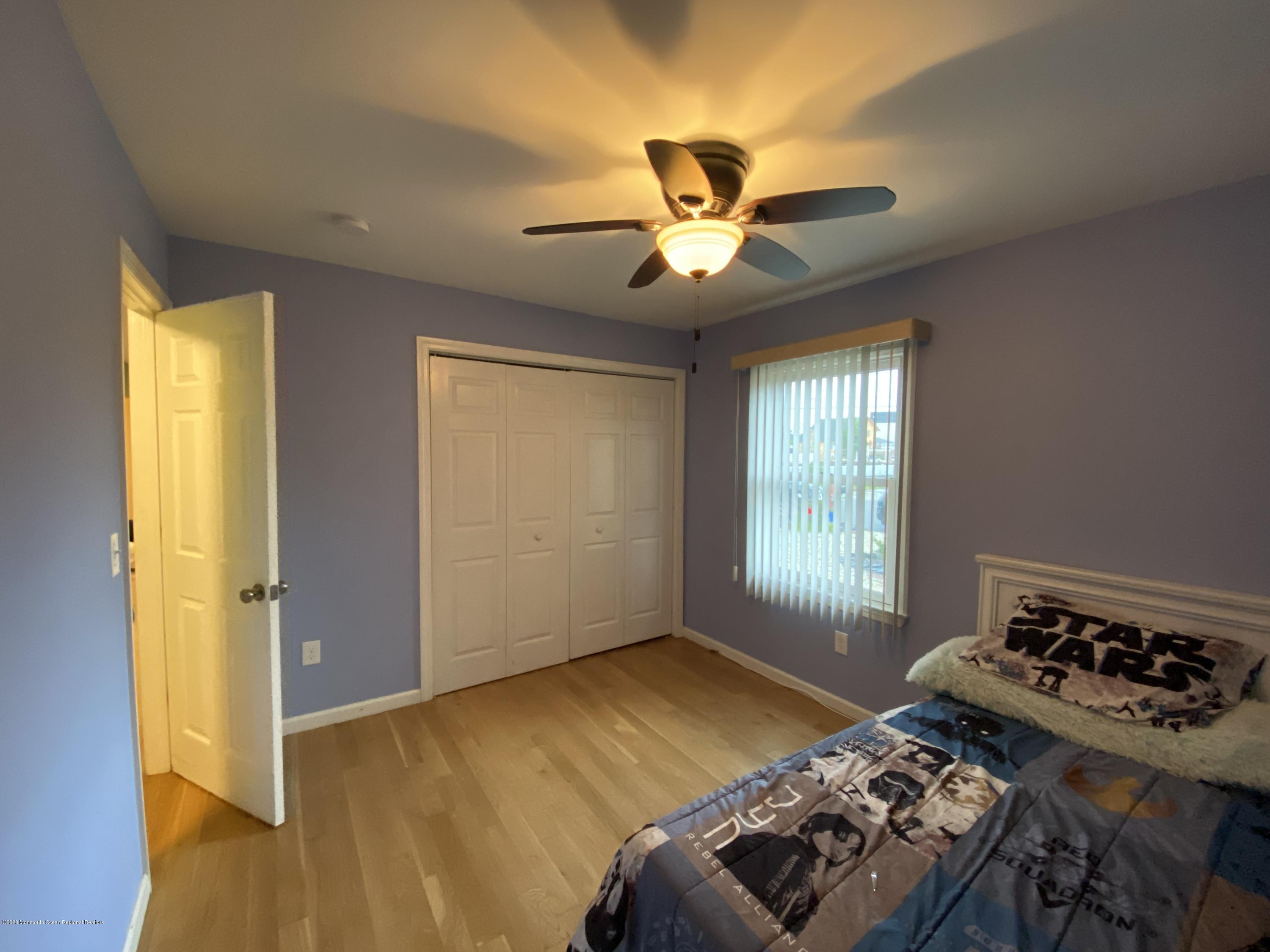 24 Cross Trees Road Brick, NJ 08723 - Photo 10 of 13 a bedroom with a bed and a window