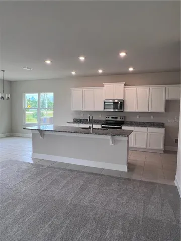 a view of kitchen with wooden floor