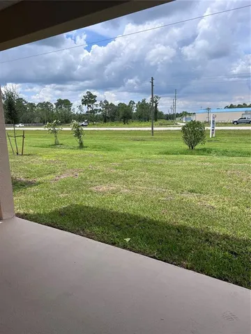 a view of a golf course with a garden