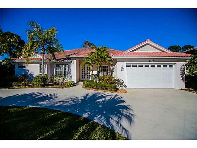 2677 Southwest Oak Ridge Road Palm City, FL 34990 - Photo 1 of 25 a view of a house with a yard and potted plants