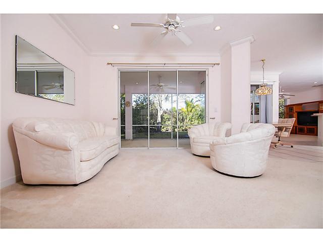 2677 Southwest Oak Ridge Road Palm City, FL 34990 - Photo 12 of 25 a living room with furniture and a potted plant