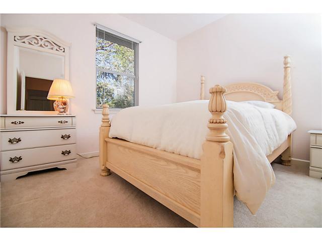 2677 Southwest Oak Ridge Road Palm City, FL 34990 - Photo 13 of 25 a bed room with a bed and a television