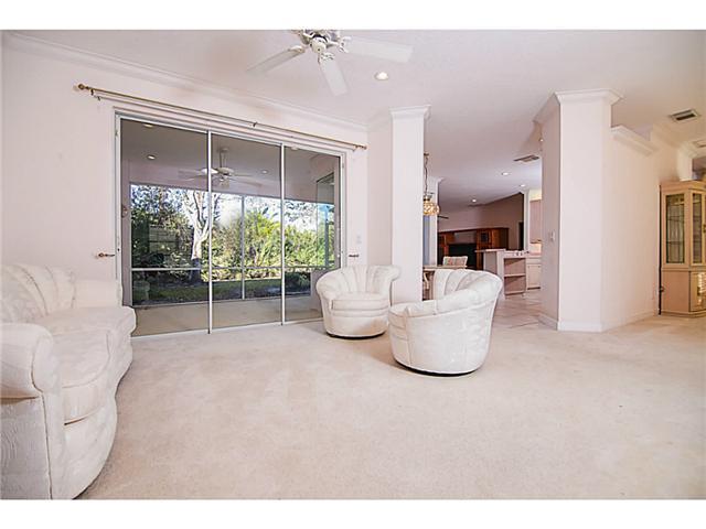 2677 Southwest Oak Ridge Road Palm City, FL 34990 - Photo 14 of 25 a room with a fountain and a floor to ceiling window