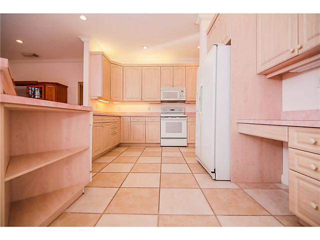 2677 Southwest Oak Ridge Road Palm City, FL 34990 - Photo 2 of 25 a kitchen with stainless steel appliances granite countertop a refrigerator and a cabinets