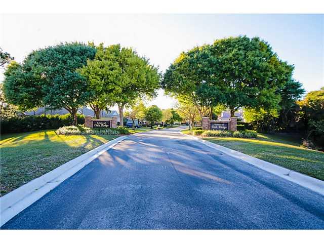 2677 Southwest Oak Ridge Road Palm City, FL 34990 - Photo 25 of 25 a view of a swimming pool and trees in the background