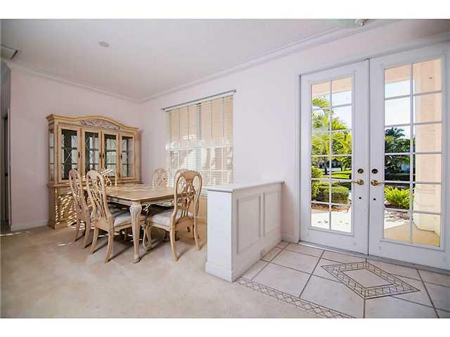 2677 Southwest Oak Ridge Road Palm City, FL 34990 - Photo 8 of 25 a dining room with furniture and window
