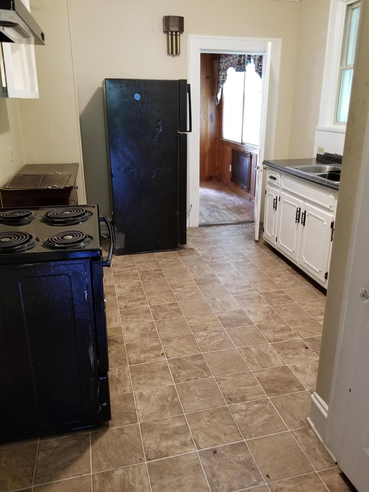 3359 Norman Bridge Road Montgomery, AL 36105 - Photo 5 of 10 a kitchen with granite countertop a stove and a refrigerator