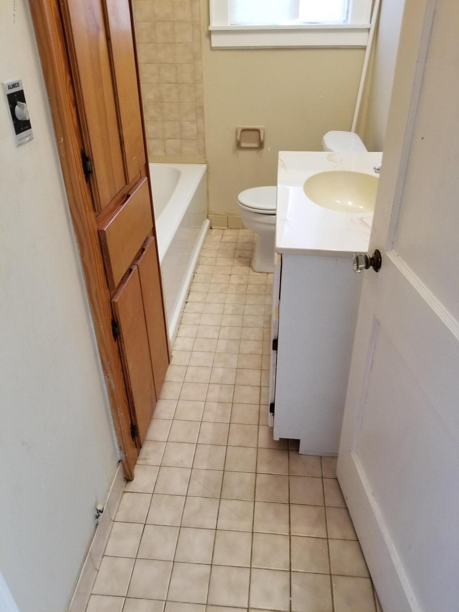 3359 Norman Bridge Road Montgomery, AL 36105 - Photo 7 of 10 a bathroom with a sink a toilet and a shower