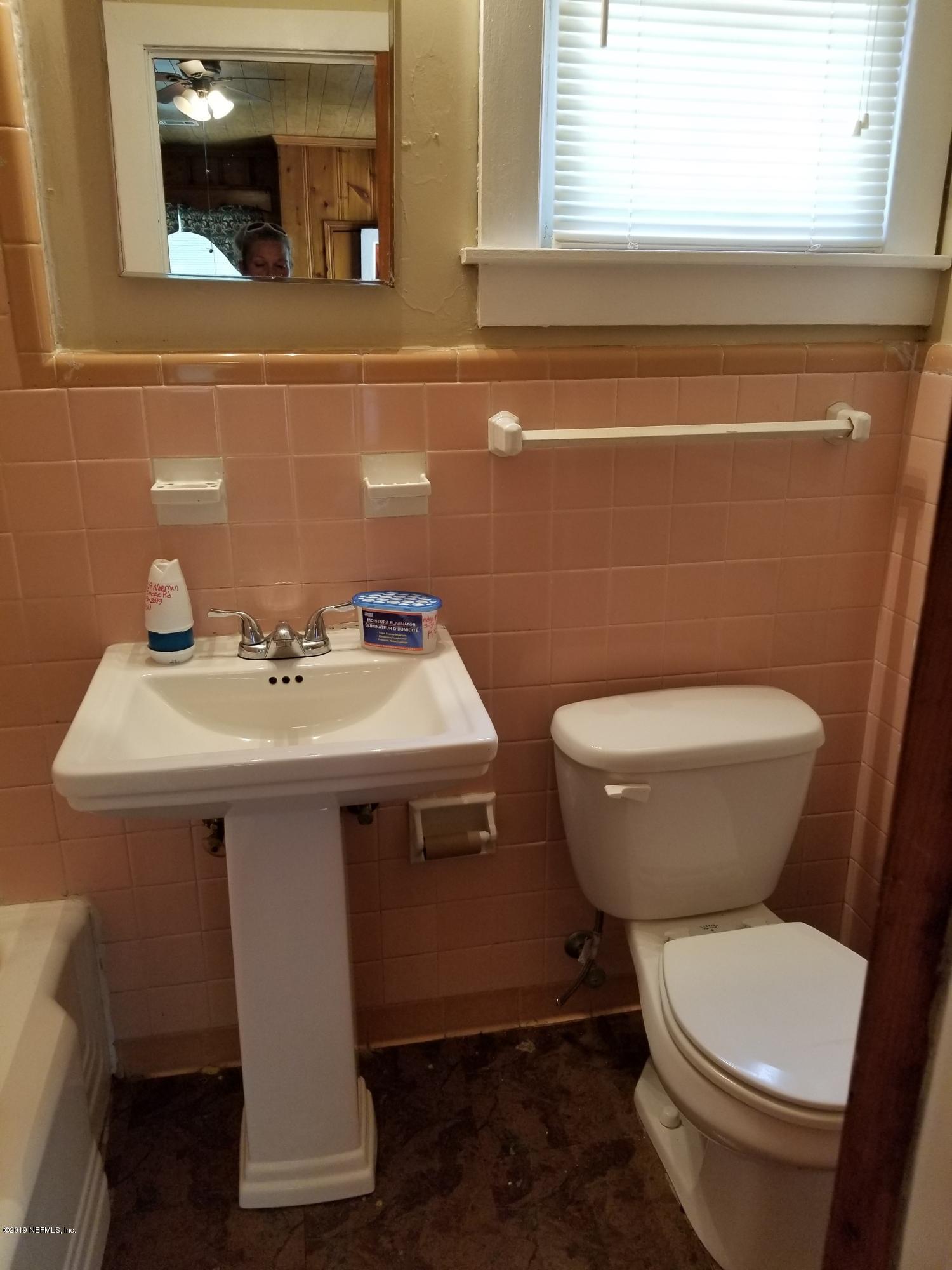 3359 Norman Bridge Road Montgomery, AL 36105 - Photo 10 of 10 a bathroom with a toilet sink and mirror