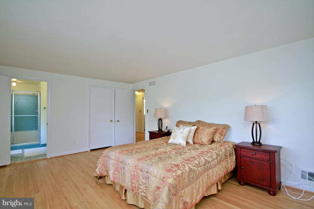 8200 Burnley Road Baltimore, MD 21204 - Photo 13 of 21 a bedroom with bed and wooden floor