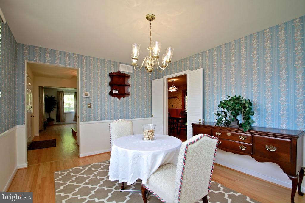 8200 Burnley Road Baltimore, MD 21204 - Photo 5 of 21 a living room with furniture and a chandelier