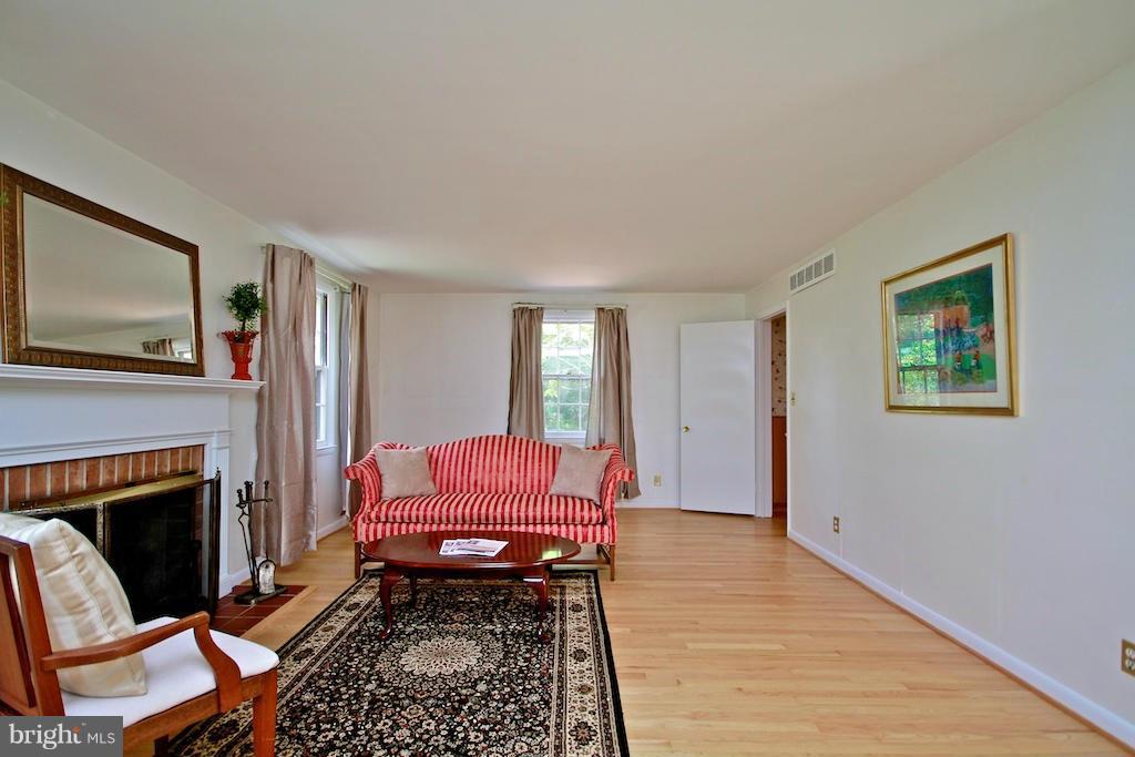 8200 Burnley Road Baltimore, MD 21204 - Photo 7 of 21 a living room with furniture and a fireplace
