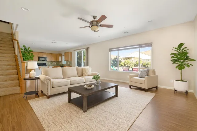 a living room with furniture and a large window