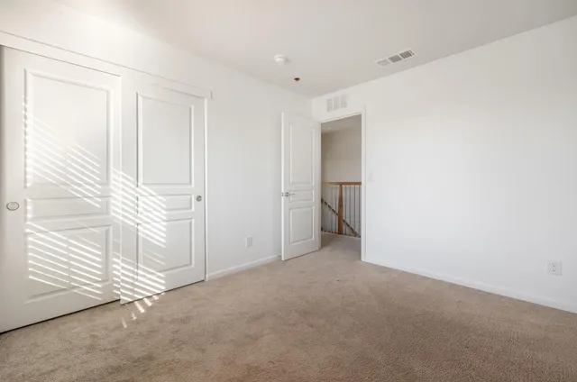 a view of a room with white walls