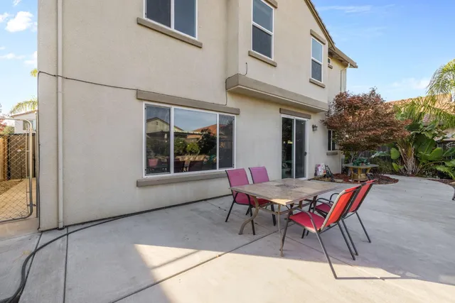 a outdoor space with a couch and chairs