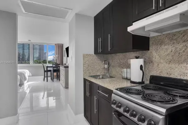 a kitchen with a stove and a sink