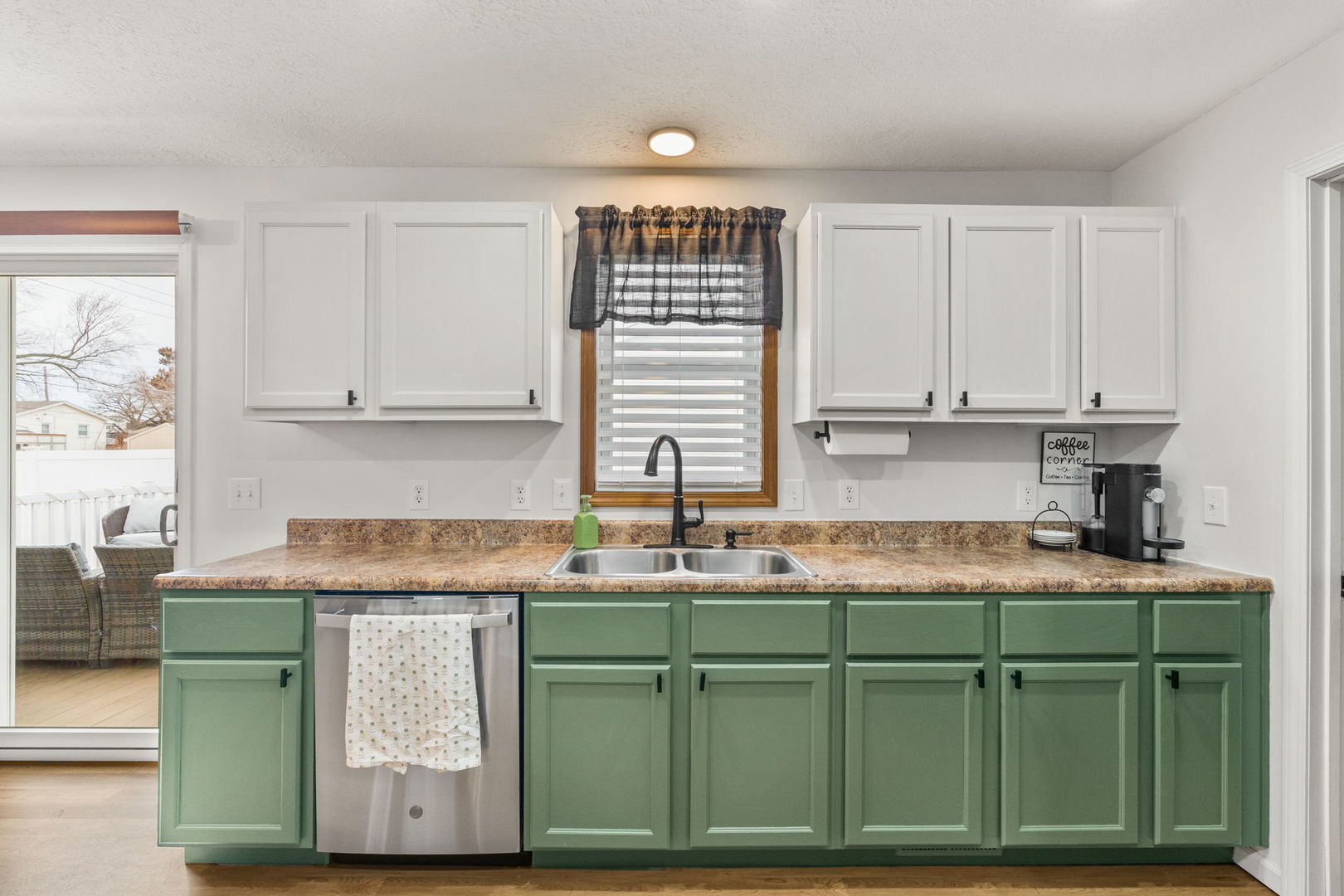 1005 17th Avenue Silvis, IL 61282 - Photo 11 of 34 a kitchen with sink cabinets and window