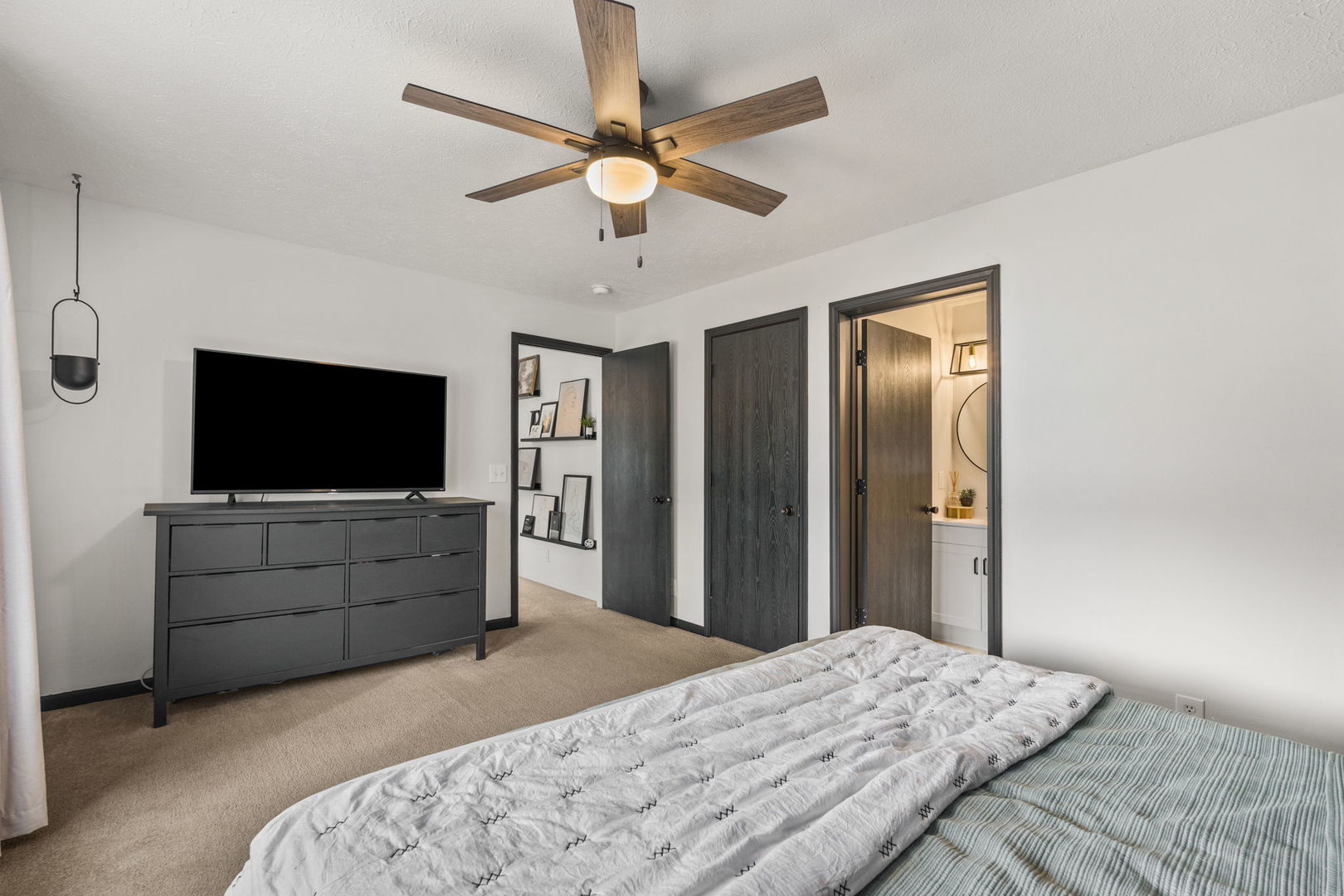1005 17th Avenue Silvis, IL 61282 - Photo 15 of 34 a bedroom with a bed and a flat screen tv