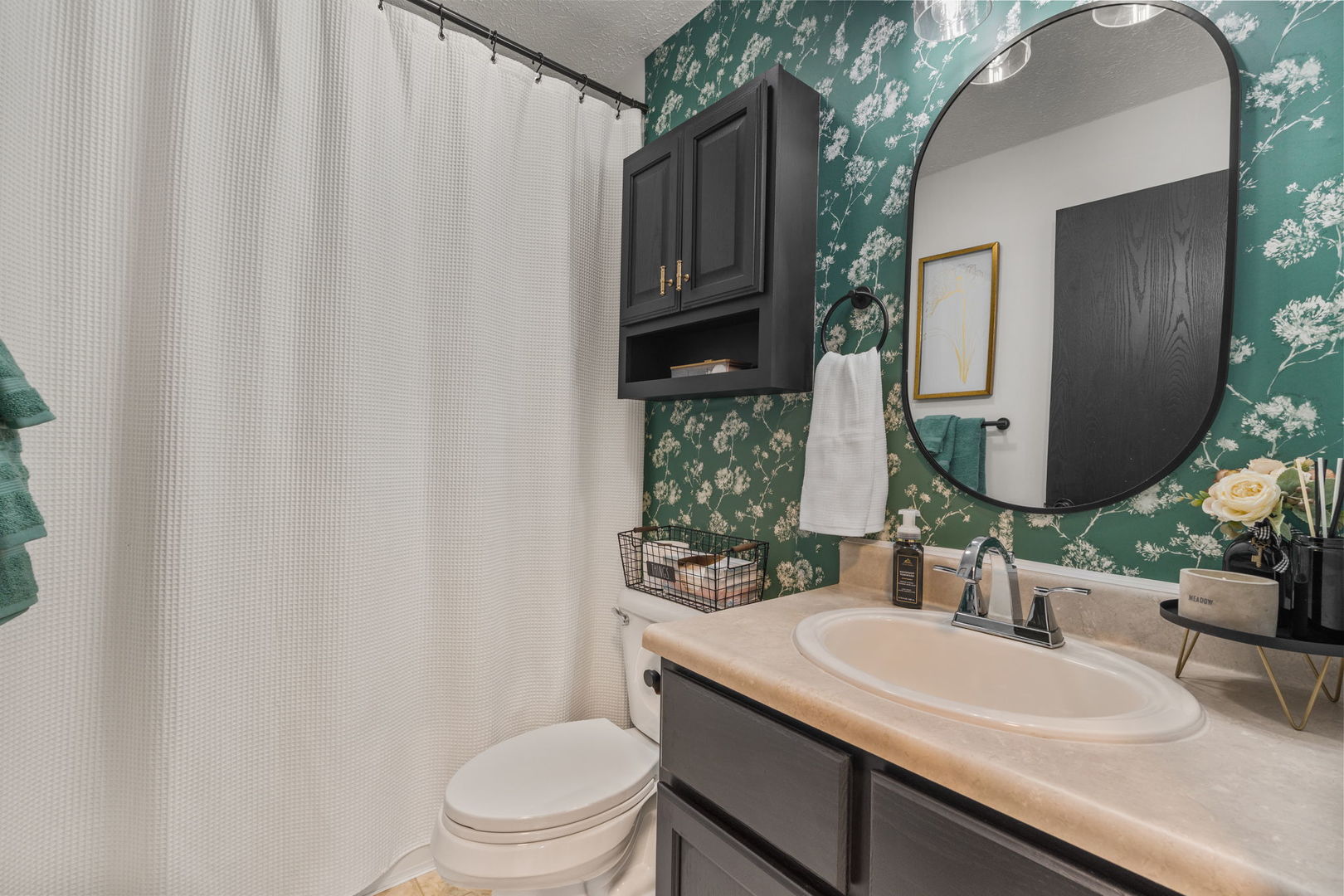 1005 17th Avenue Silvis, IL 61282 - Photo 19 of 34 a bathroom with a granite countertop sink vanity mirror and toilet