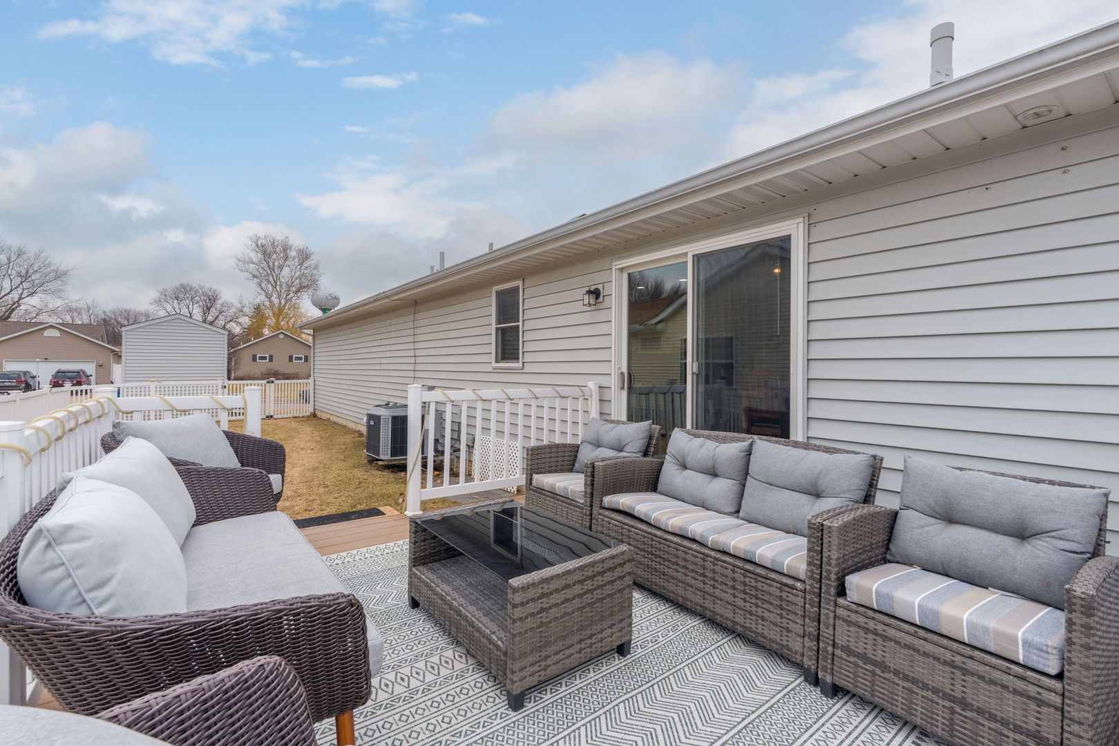 1005 17th Avenue Silvis, IL 61282 - Photo 27 of 34 a view of a patio with couches and a potted plant on a table