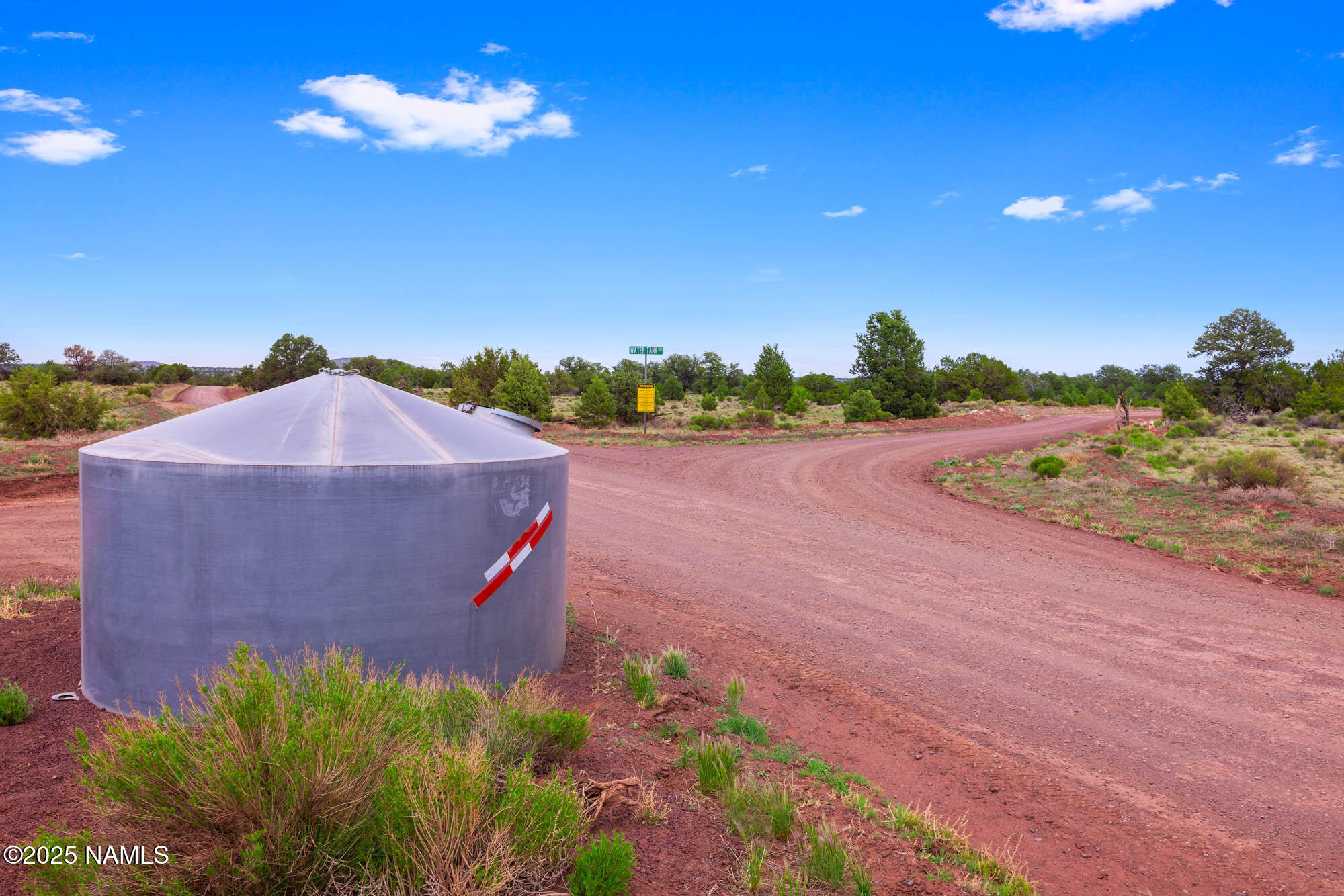 8449 Water Tank Circle, Unit A Williams, AZ 86046 - Photo 15 of 56 a view of a yard in front of a house with a yard