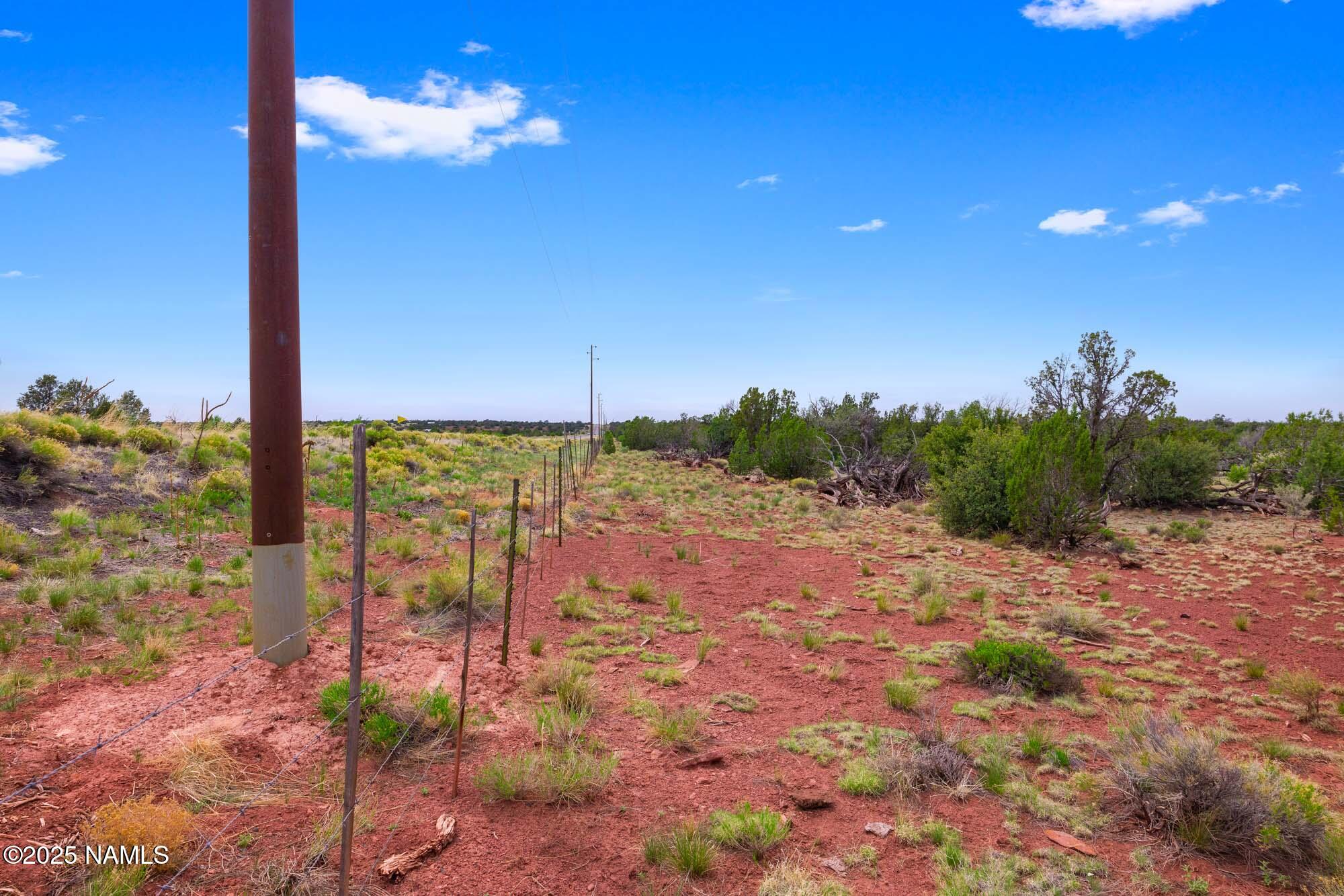 8449 Water Tank Circle, Unit A Williams, AZ 86046 - Photo 33 of 56 a view of a yard with an ocean view