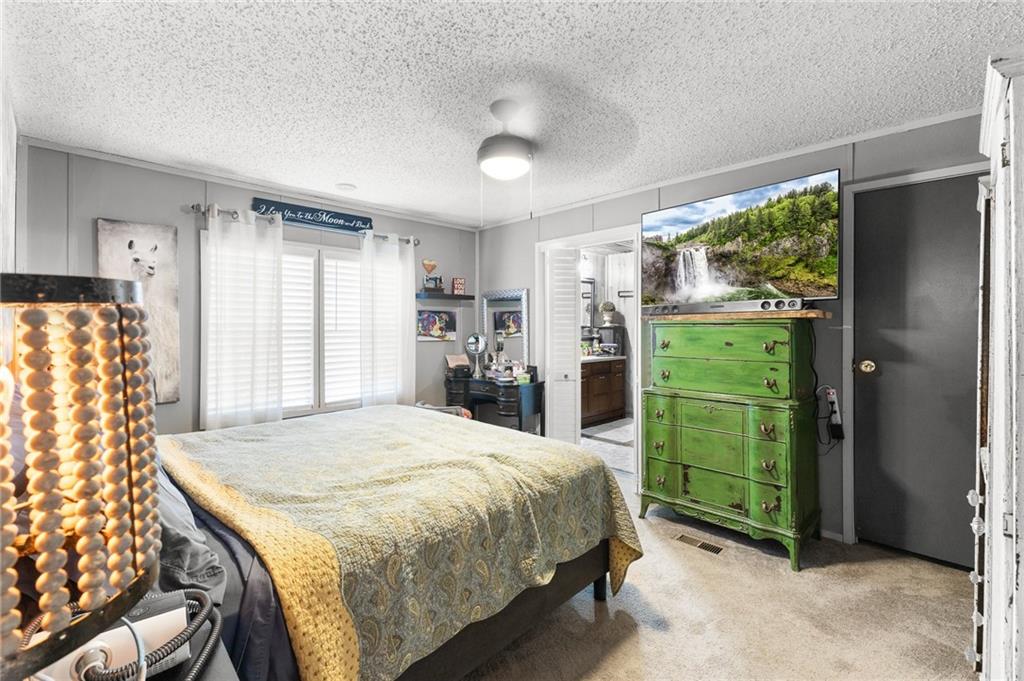 224 Hebron Road Commerce, GA 30530 - Photo 11 of 25 a bedroom with a bed and a window