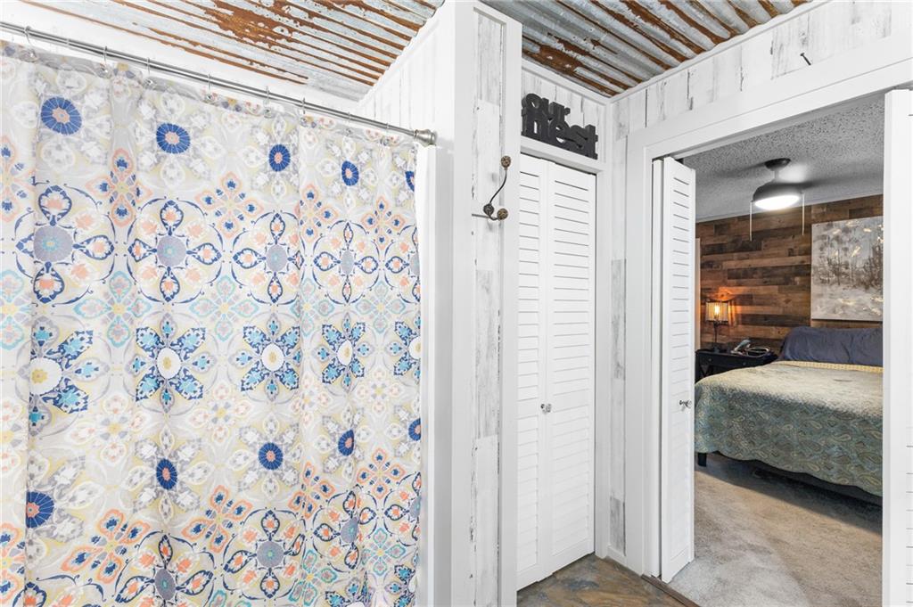 224 Hebron Road Commerce, GA 30530 - Photo 14 of 25 a view of a bedroom with bed and furniture