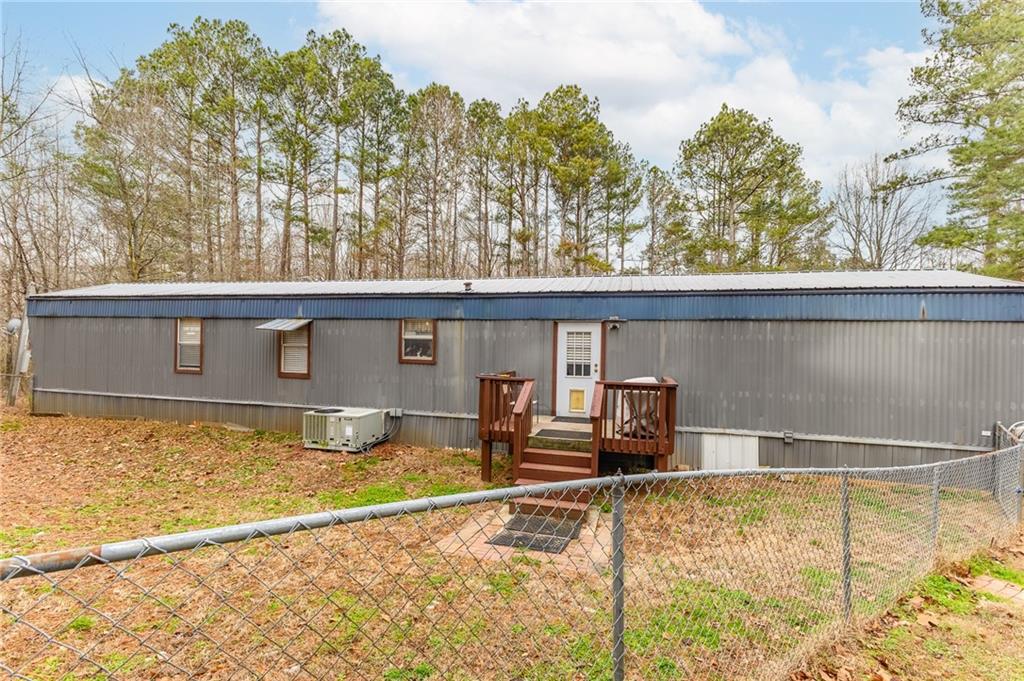 224 Hebron Road Commerce, GA 30530 - Photo 20 of 25 a view of a house with a yard